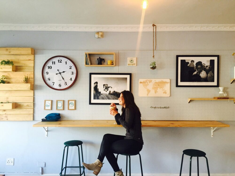 first time buyer mortgage no deposit - woman sitting on a stool in her home